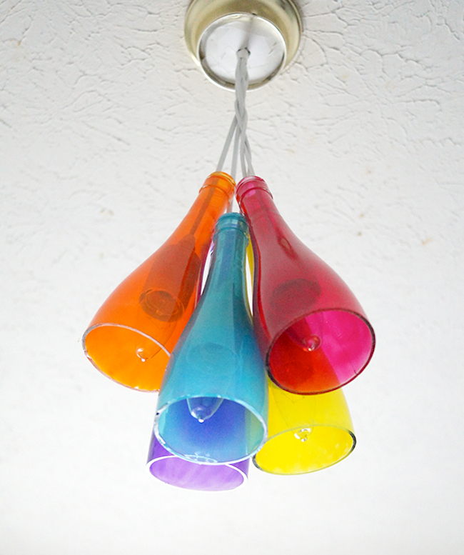 Make-a-DIY-chandelier-using-wine-bottles-and-Mod-Podge-Sheer-Colors