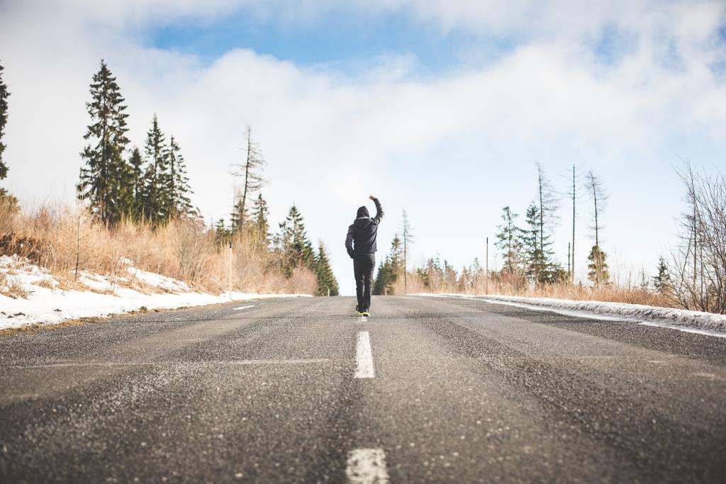 man-in-a-winner-pose-walking-on-the-road-picjumbo-com